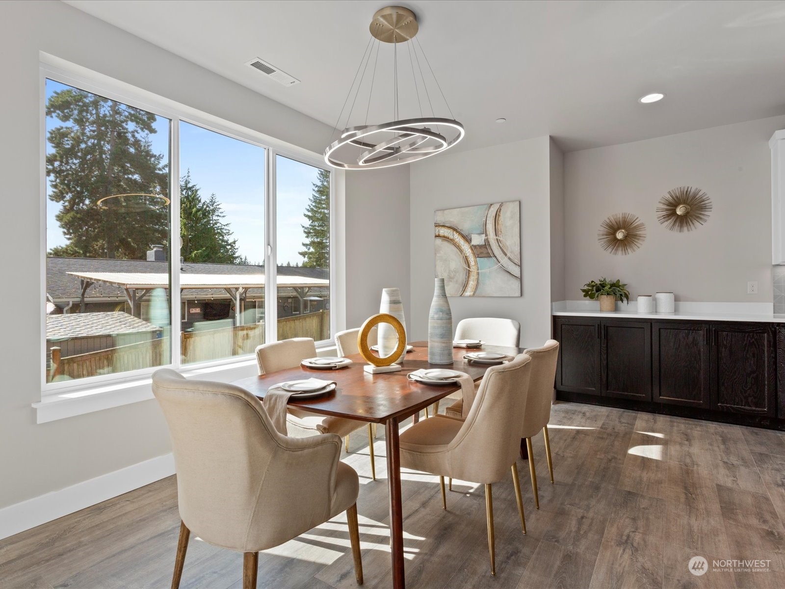 21609 1st Avenue West Bothell, WA 98021 - Photo 9 of 40 a dining room with furniture a window and wooden floor