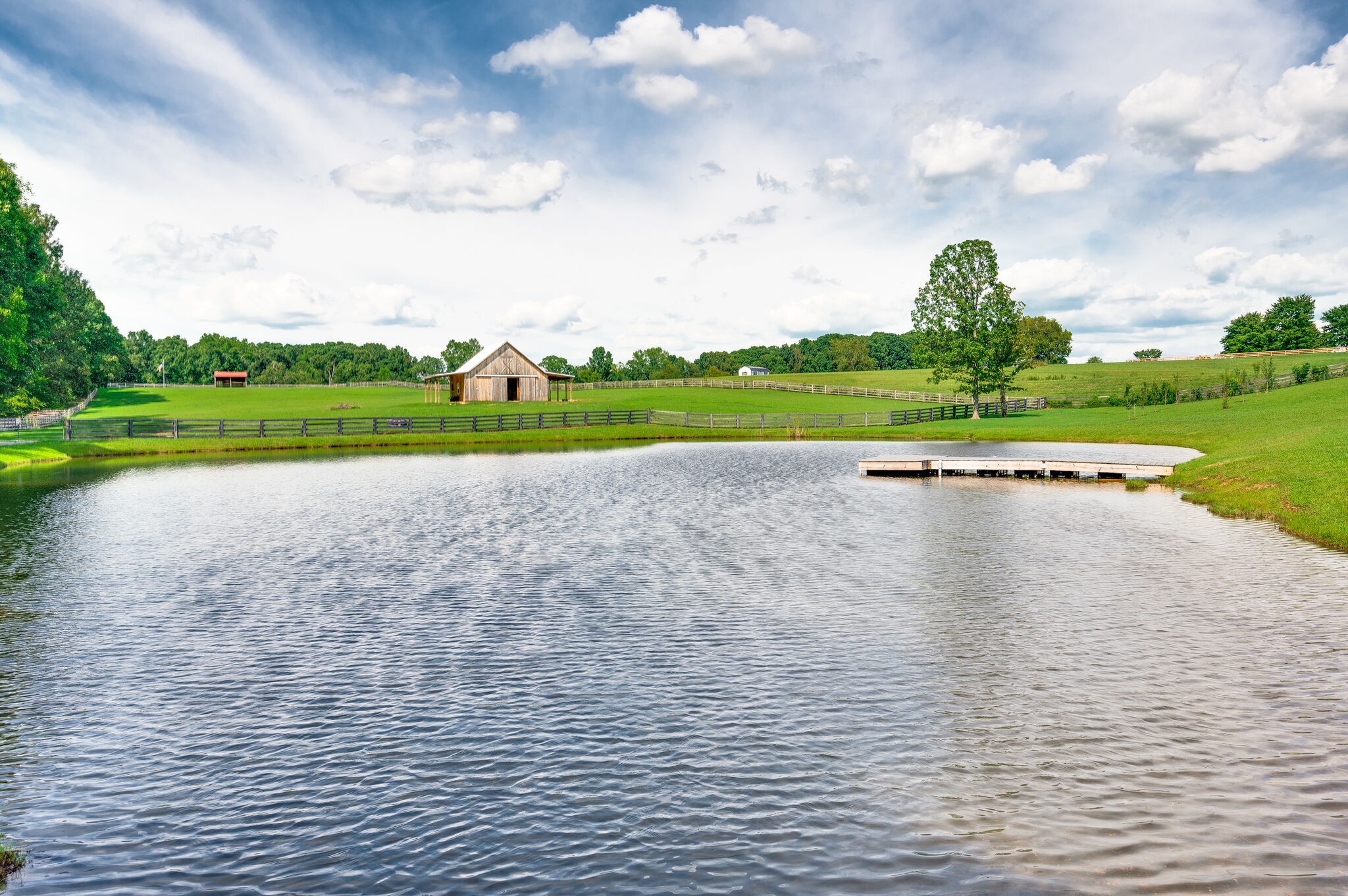 7676 Barnhill Road Primm Springs, TN 38476 - Photo 50 of 69 a view of a lake with houses in back