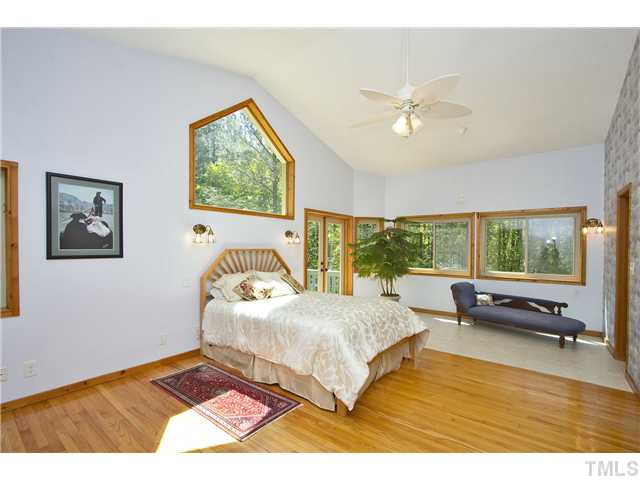 3729 Bosco Road New Hill, NC 27562 - Photo 12 of 25 You may never want to leave this master suite with sitting area, two bath rooms, two walk-in closets and a private deck. More great views!!!! Master Suite