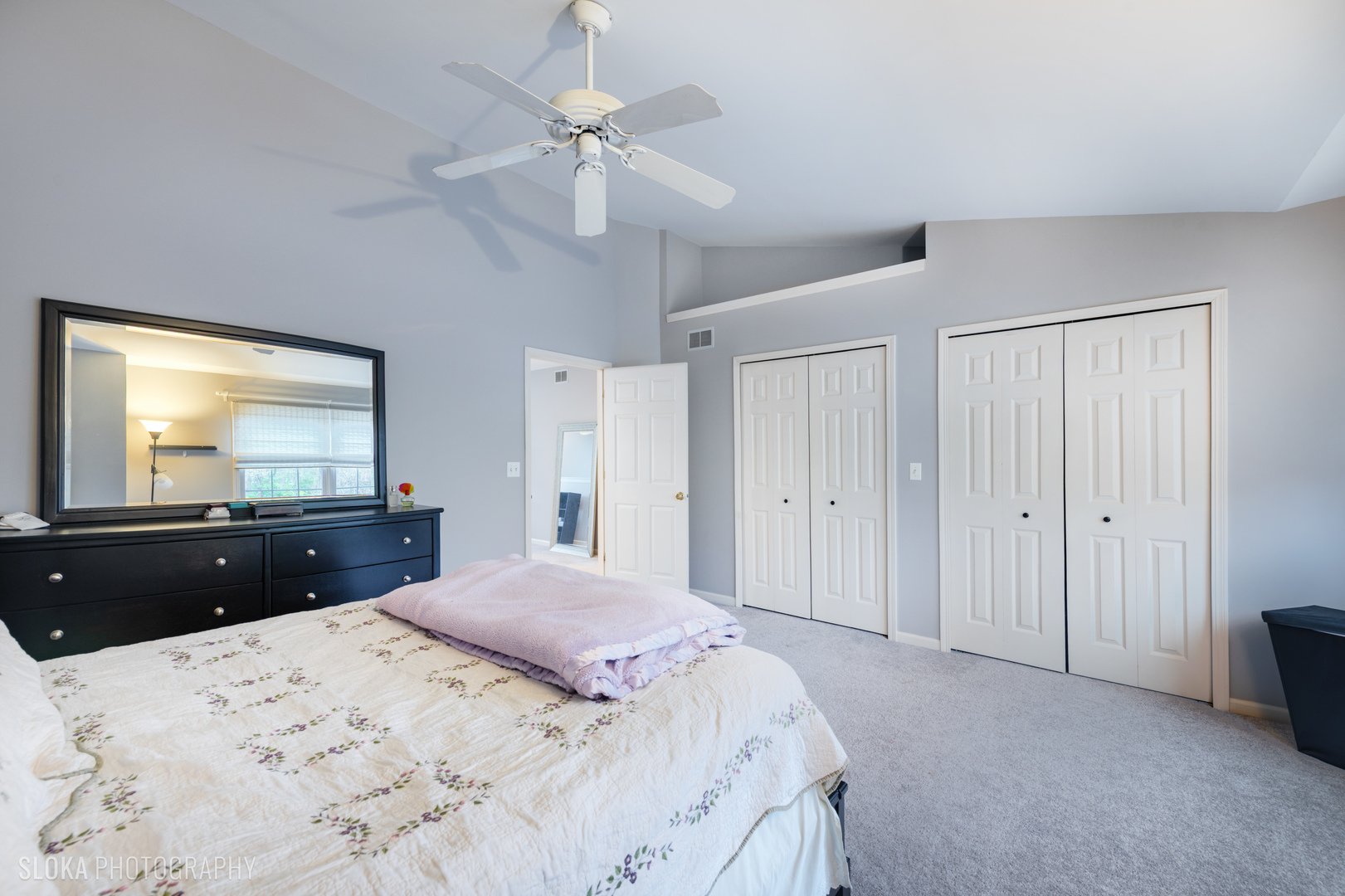 229 Spring Point Drive Carpentersville, IL 60110 - Photo 16 of 27 a bedroom with a bed and a dresser