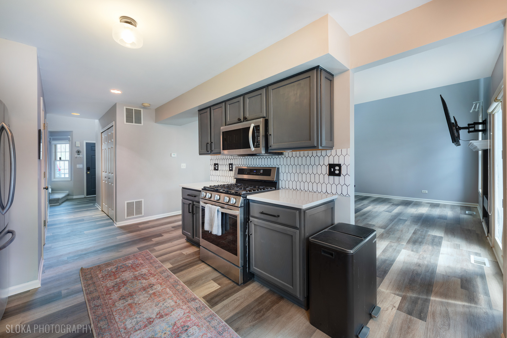229 Spring Point Drive Carpentersville, IL 60110 - Photo 8 of 27 a kitchen with granite countertop a stove top oven and refrigerator