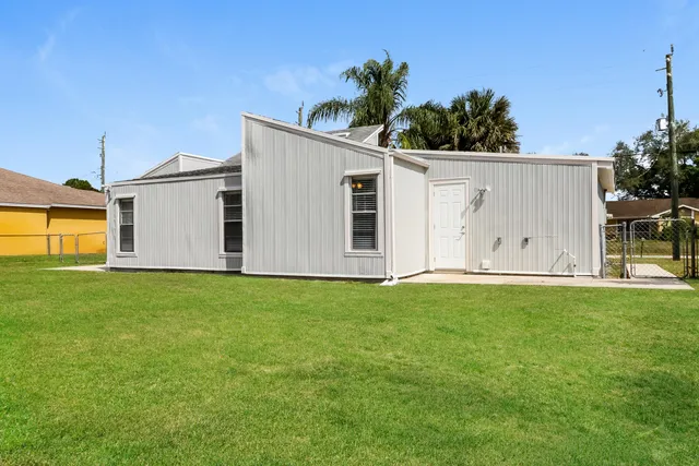 a house view with a backyard space