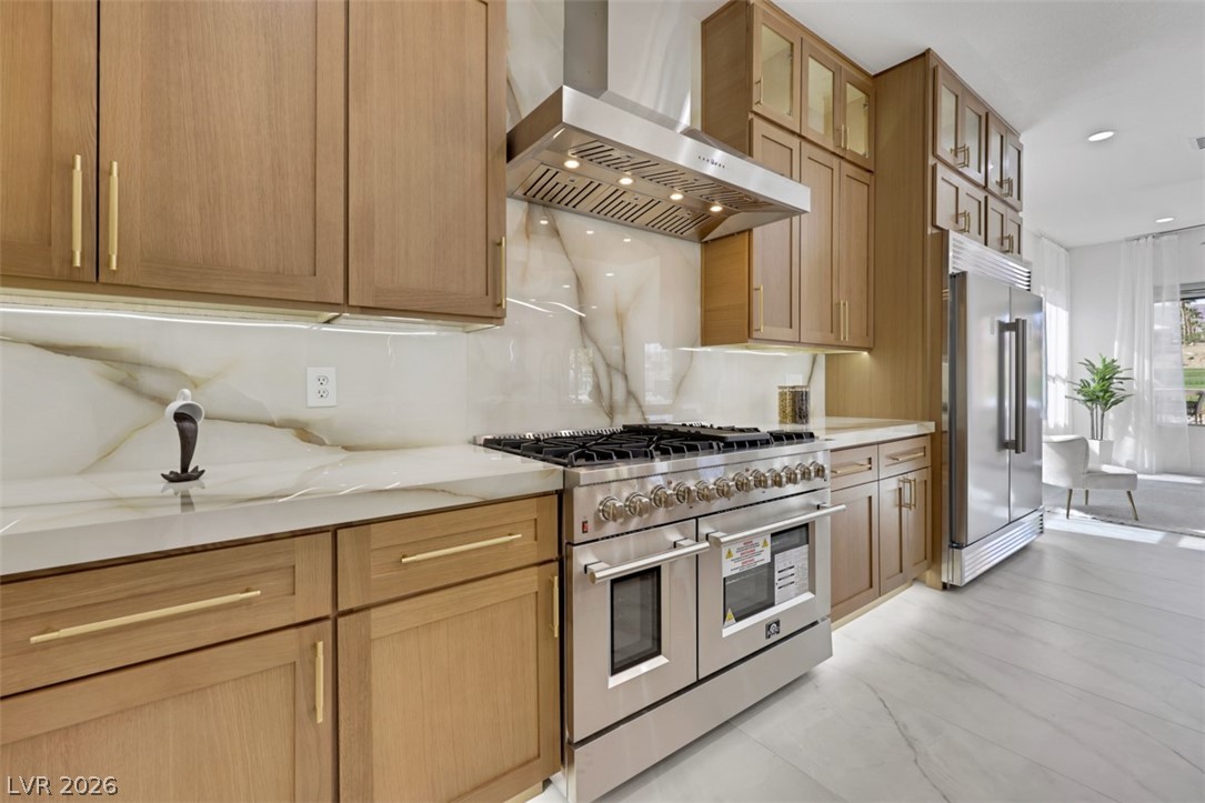 5015 Rivedro Street Las Vegas, NV 89135 - Photo 4 of 91 Culinary excellence awaits with a professional-grade range, stainless steel appliances, and gleaming tile floors.