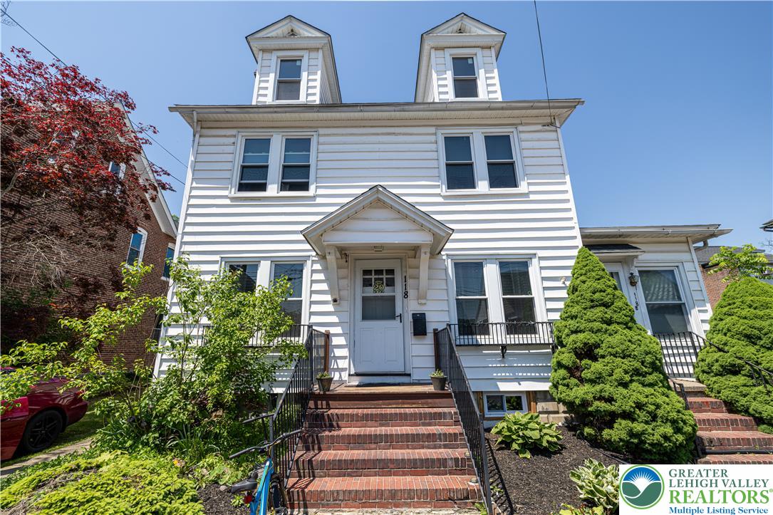 118 South 3rd Street Bangor, PA 18013 - Photo 1 of 33 This charming home showcases a classic facade with dormer windows and inviting brick steps.