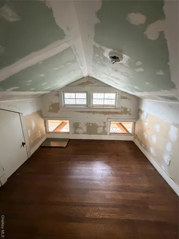 a view of a room with lot of gym equipment