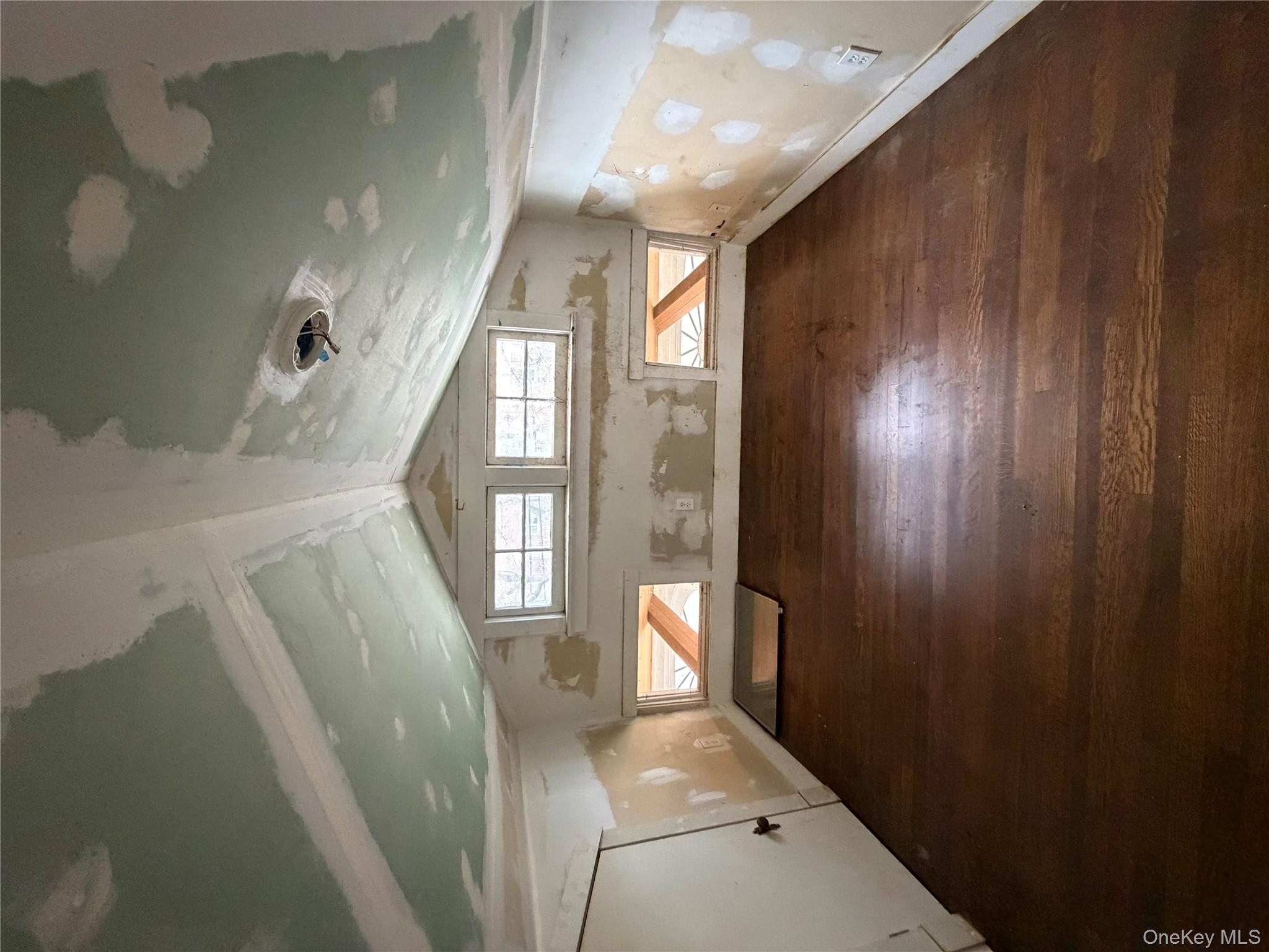 a view of a room with lot of gym equipment