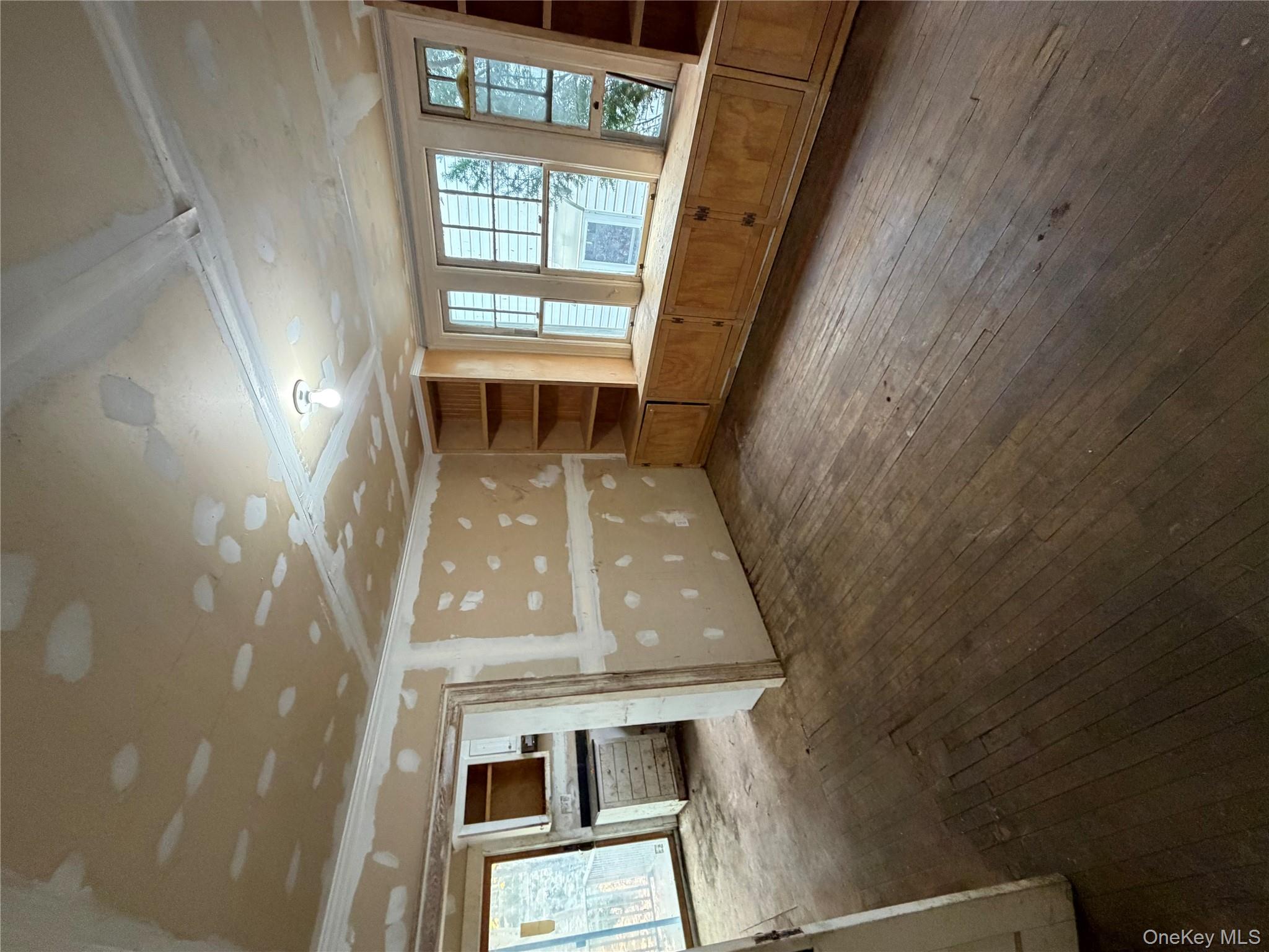 244 Tibbetts Road Yonkers, NY 10705 - Photo 16 of 28 a living room with furniture and a window