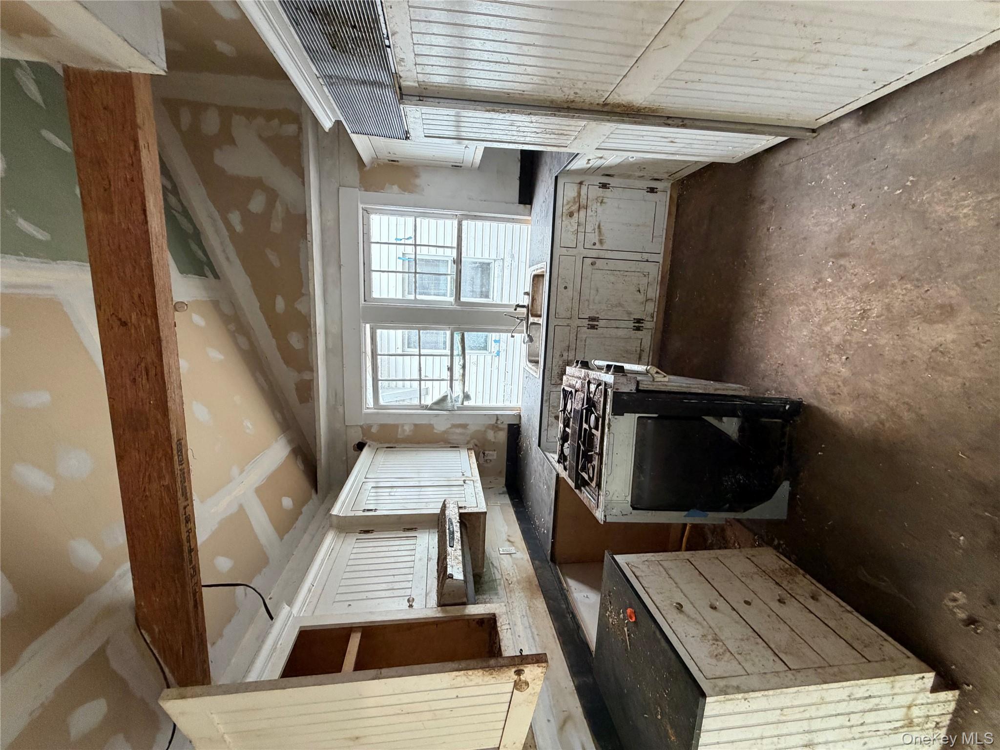 244 Tibbetts Road Yonkers, NY 10705 - Photo 18 of 28 a kitchen with sink a stove and refrigerator