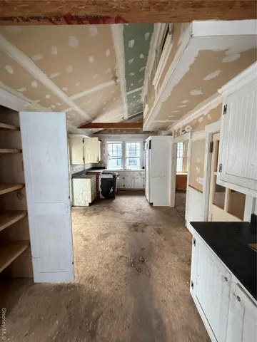 a view of a kitchen with furniture and a kitchen view