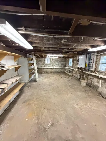 a view of room with wooden floor