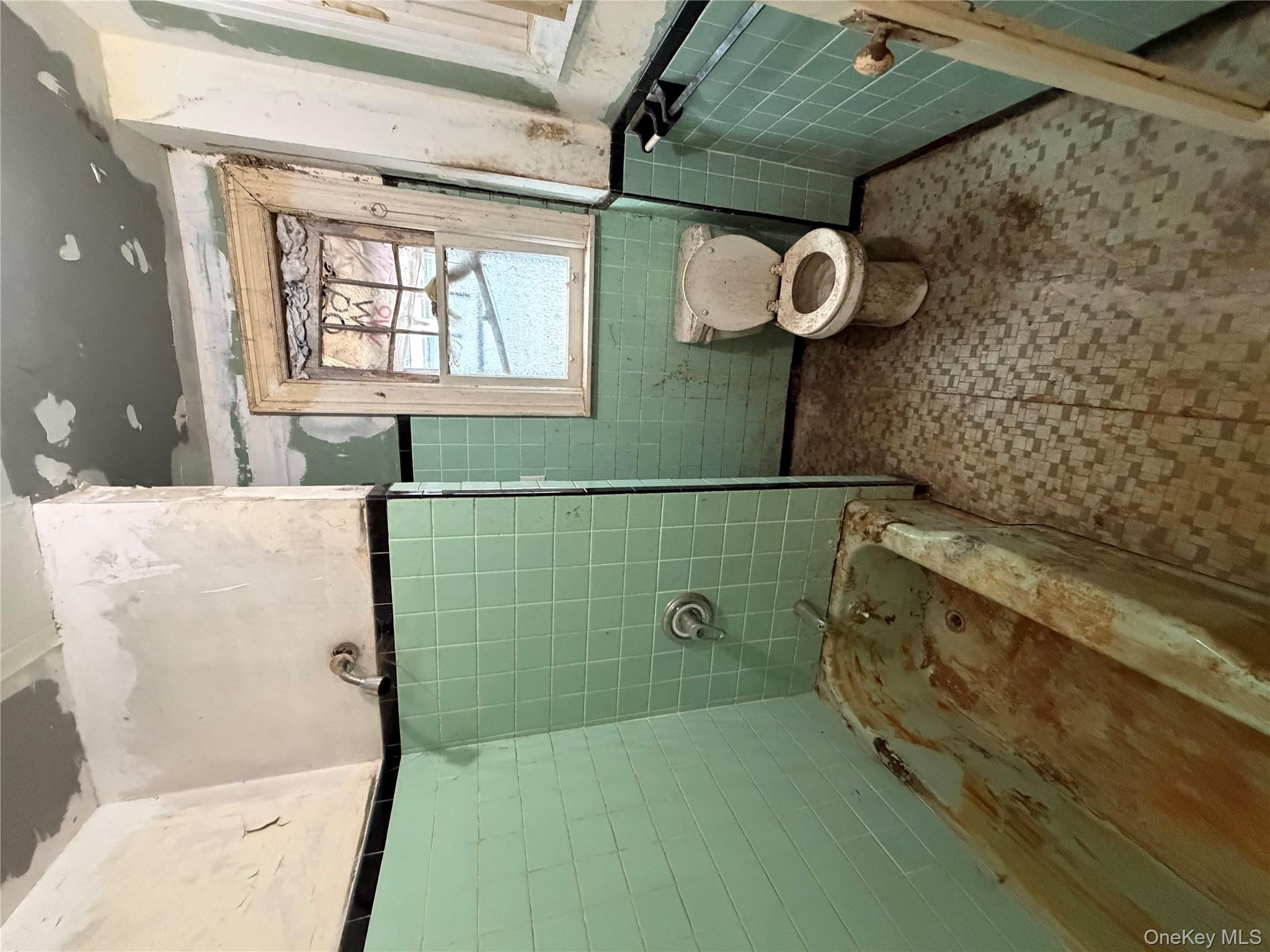 244 Tibbetts Road Yonkers, NY 10705 - Photo 28 of 28 a bathroom with a toilet and a shower