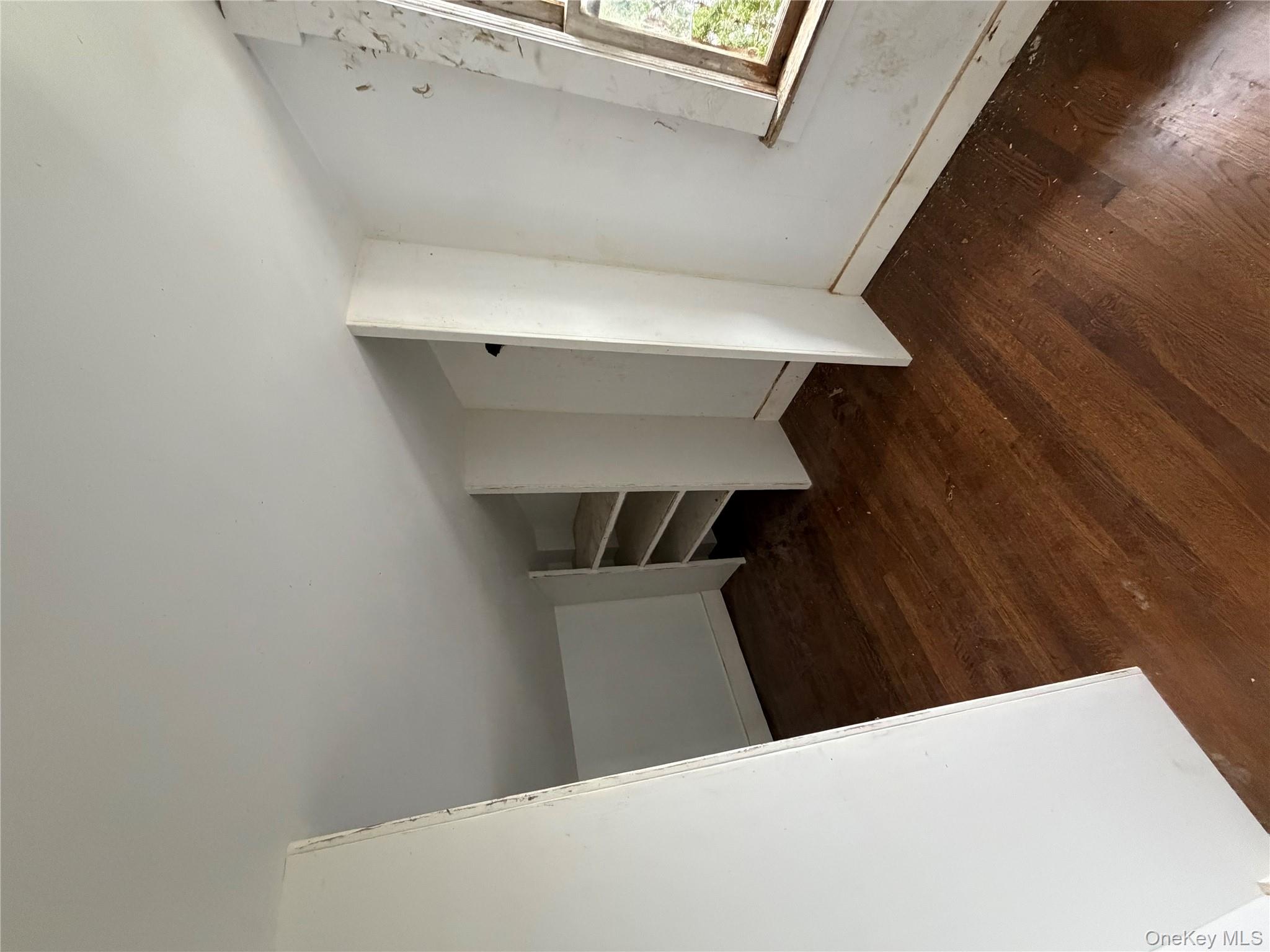 244 Tibbetts Road Yonkers, NY 10705 - Photo 6 of 28 wooden floor in an empty room with a window