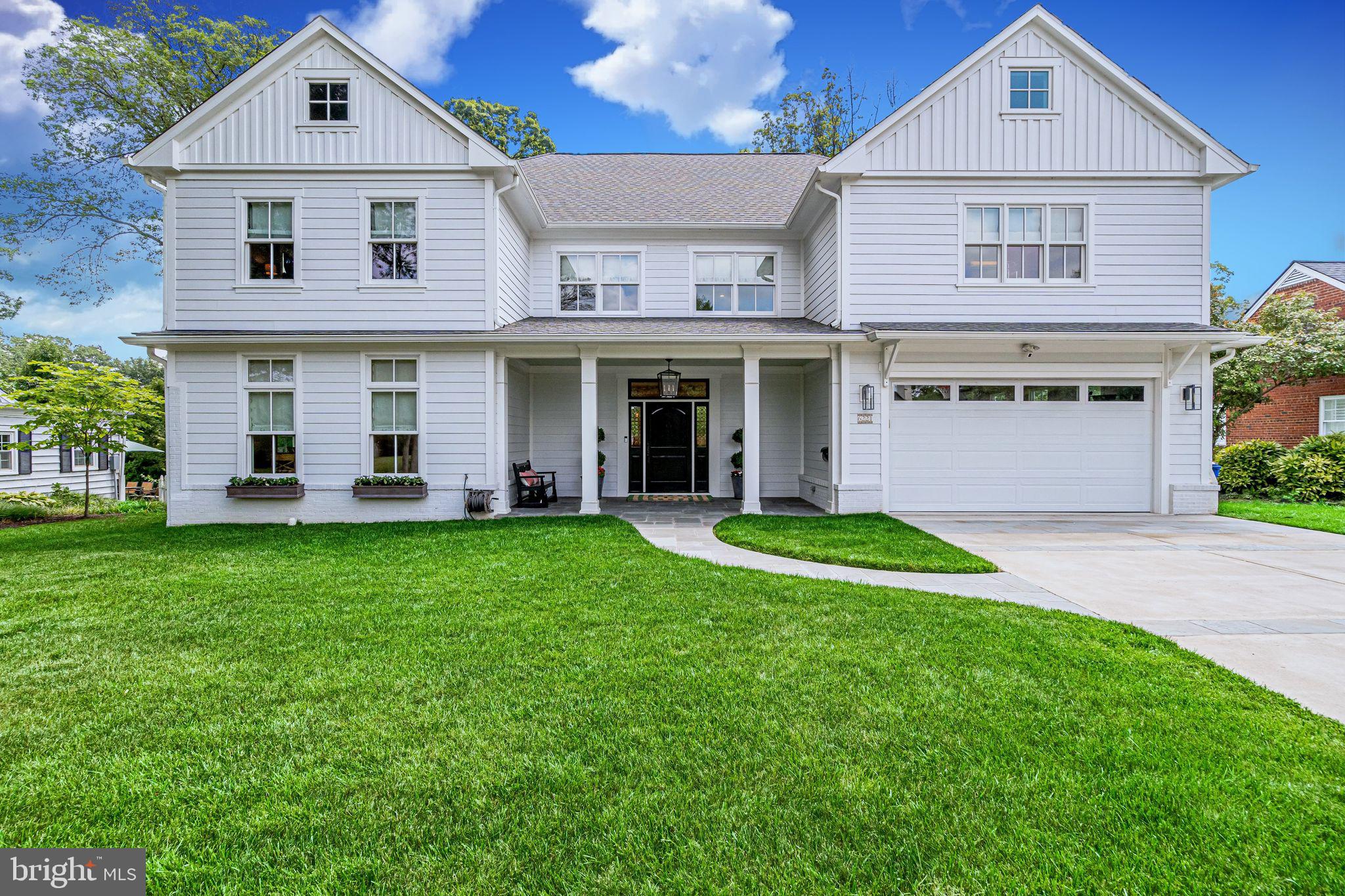 6221 Arkendale Road Alexandria, VA 22307 - Photo 1 of 60 a front view of a house with a yard and garage