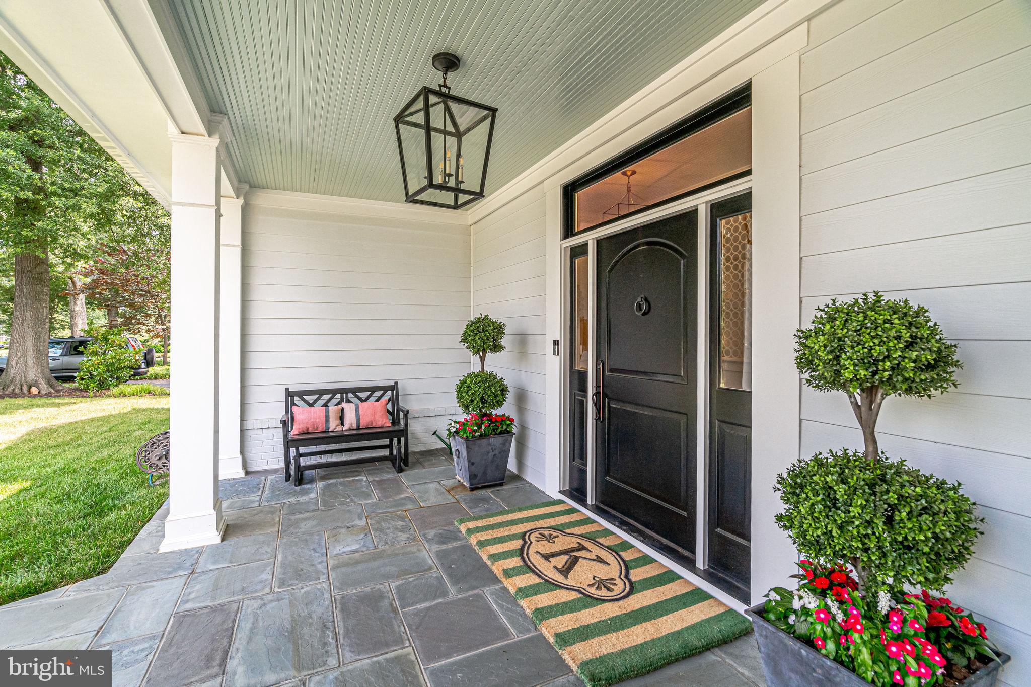 6221 Arkendale Road Alexandria, VA 22307 - Photo 2 of 60 a front view of a house with a garden