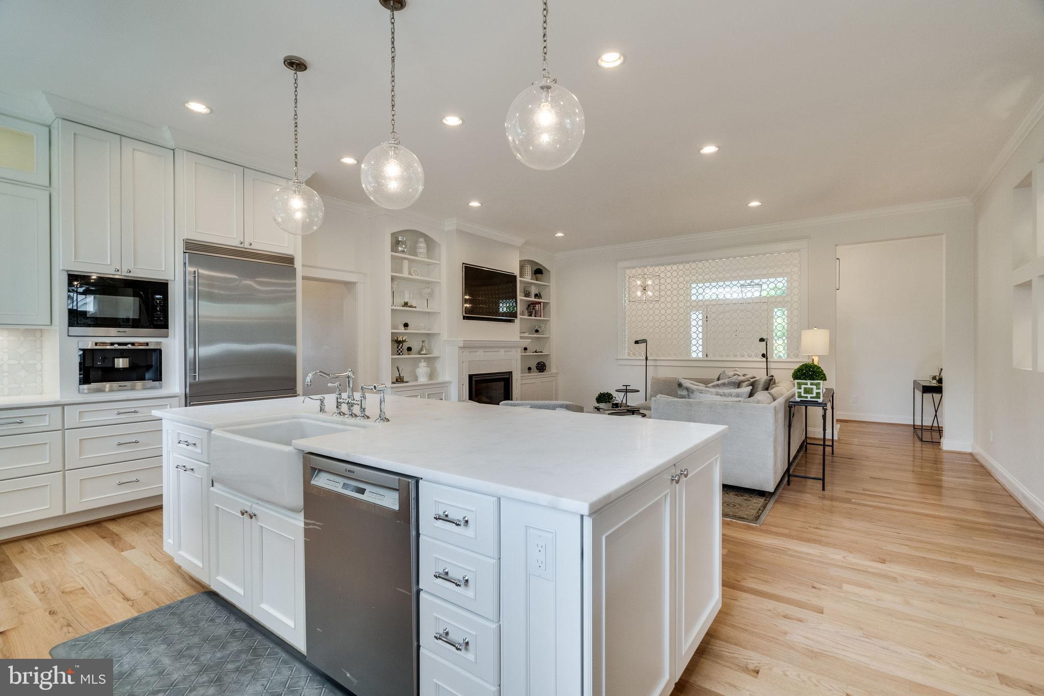 6221 Arkendale Road Alexandria, VA 22307 - Photo 14 of 60 a large kitchen with kitchen island a sink and white appliances