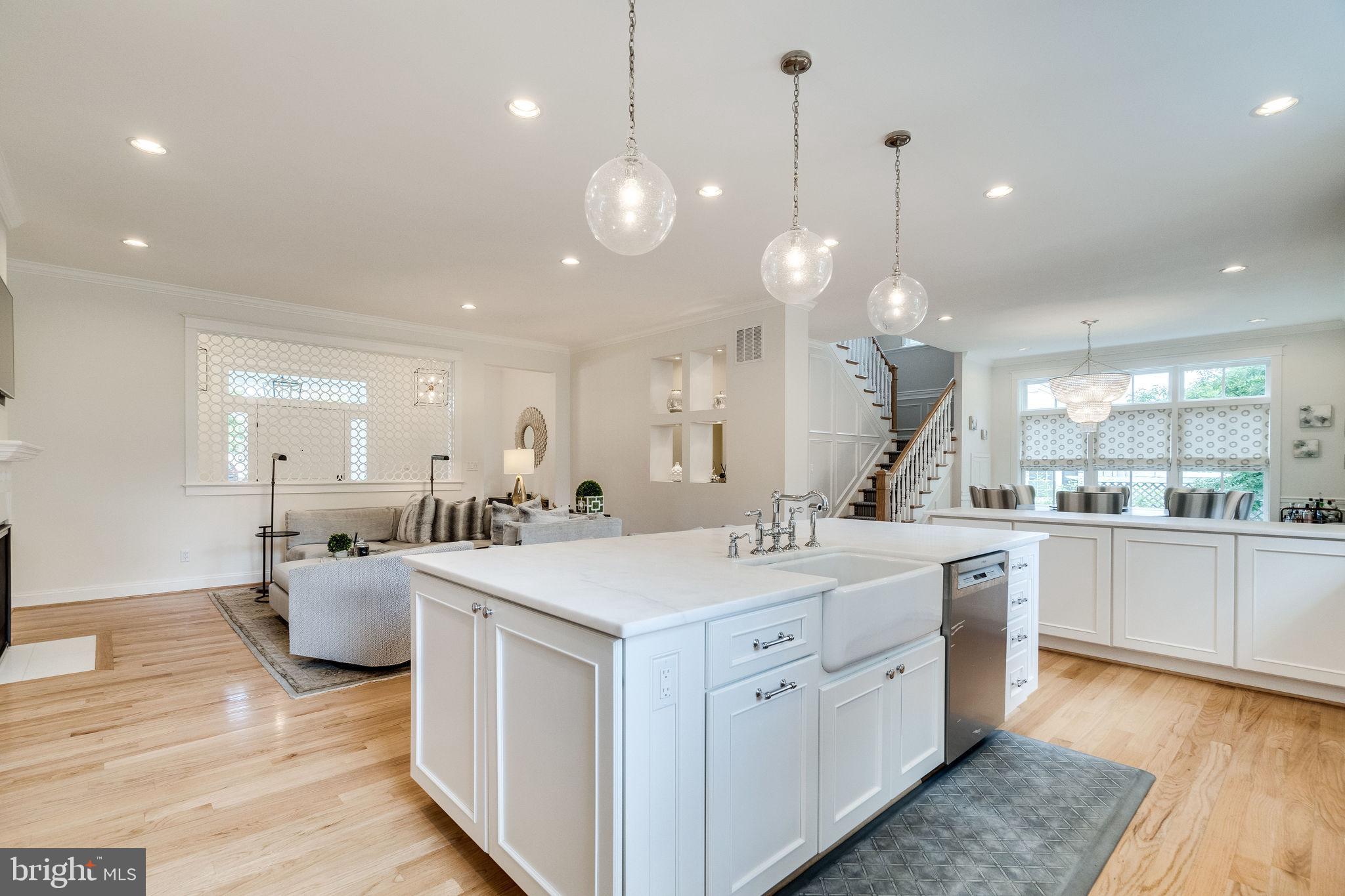 6221 Arkendale Road Alexandria, VA 22307 - Photo 16 of 60 a large kitchen with kitchen island a sink counter space appliances and a living room view