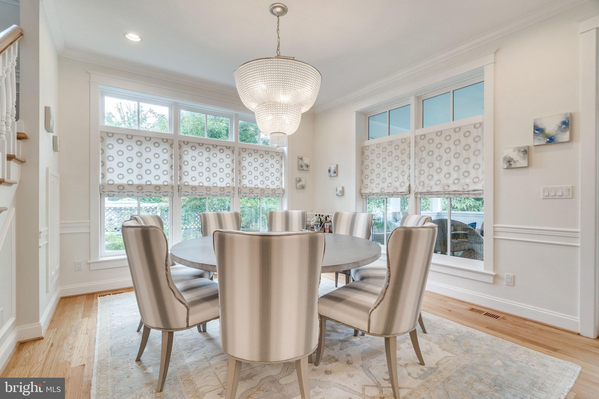 6221 Arkendale Road Alexandria, VA 22307 - Photo 18 of 60 a dining room with furniture a chandelier and wooden floor