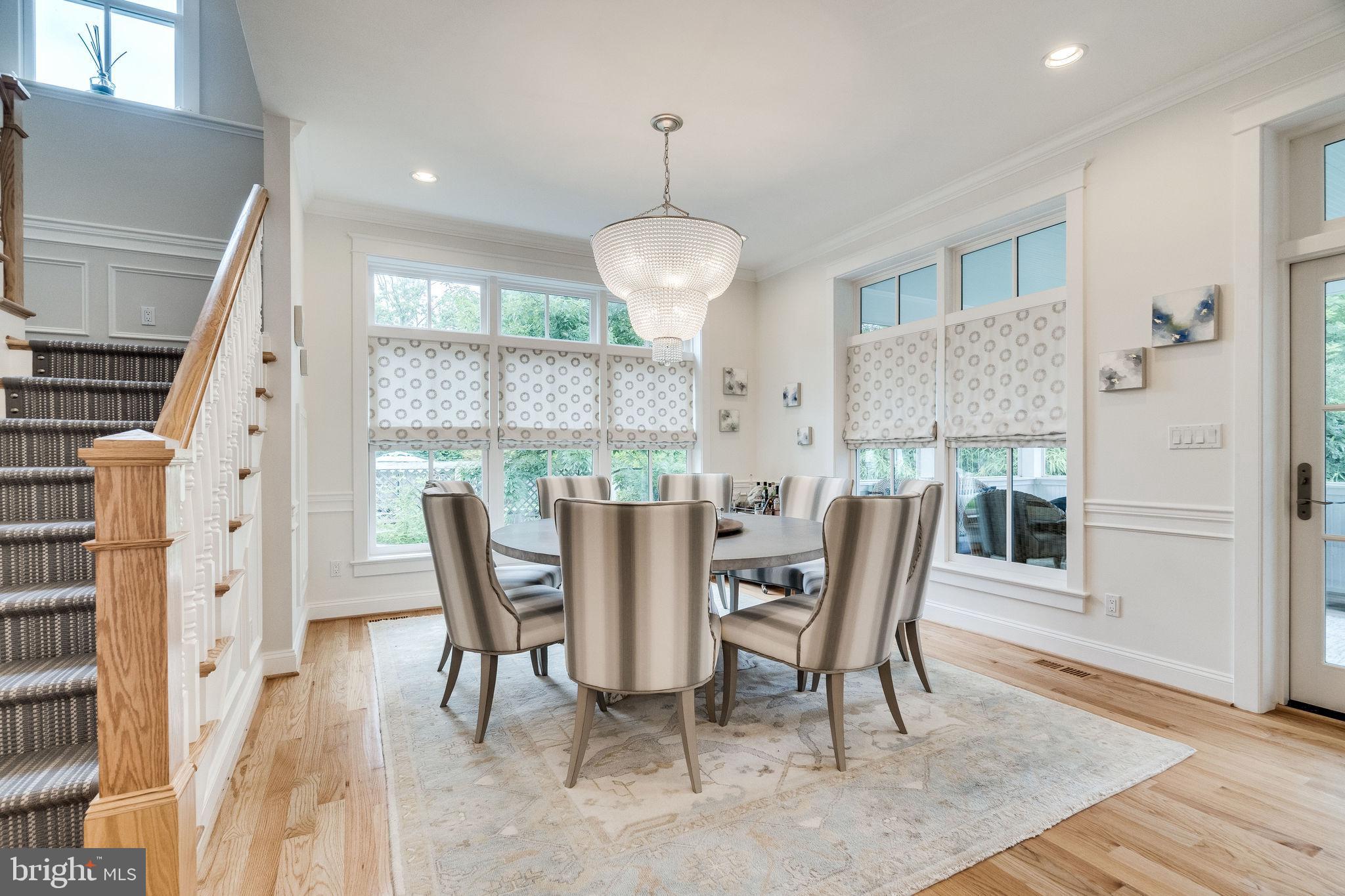 6221 Arkendale Road Alexandria, VA 22307 - Photo 19 of 60 a dining room with furniture a chandelier and wooden floor