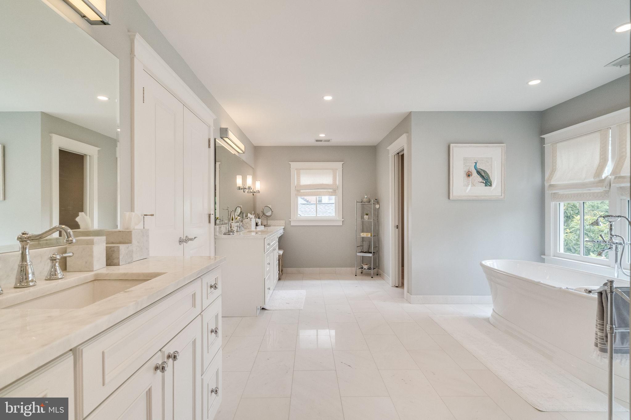 6221 Arkendale Road Alexandria, VA 22307 - Photo 29 of 60 a spacious bathroom with a double vanity sink a mirror and a bathtub