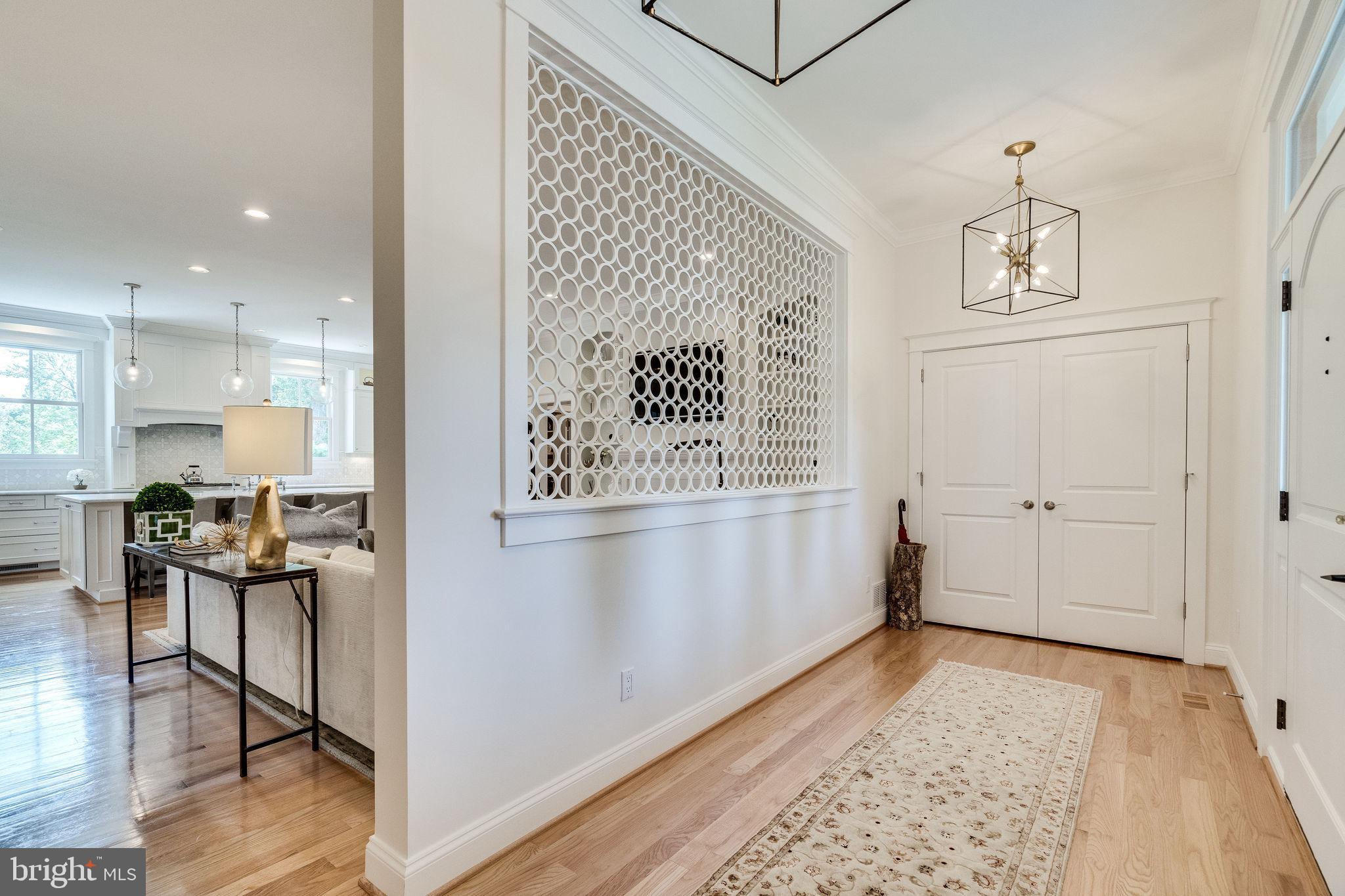 6221 Arkendale Road Alexandria, VA 22307 - Photo 5 of 60 a view of a hallway with furniture and wooden floor