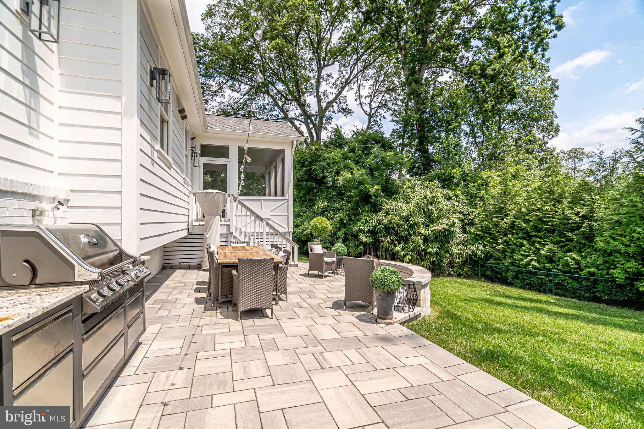 6221 Arkendale Road Alexandria, VA 22307 - Photo 56 of 60 a view of a patio with a table and chairs and potted plants