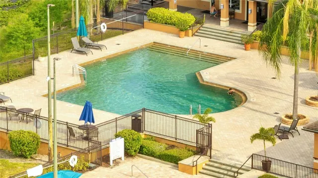 a view of swimming pool with a patio