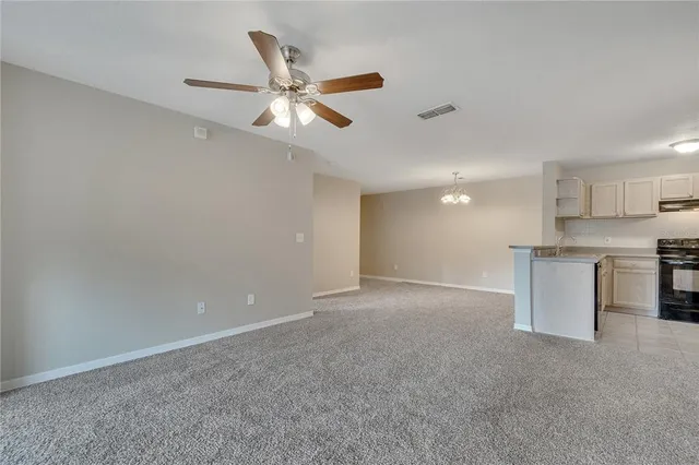 a view of a kitchen with a sink and a window