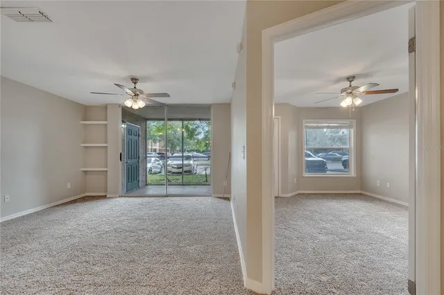 a view of an empty room with a window