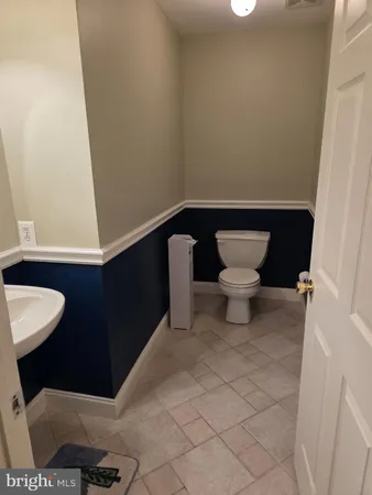 a bathroom with a toilet and a sink
