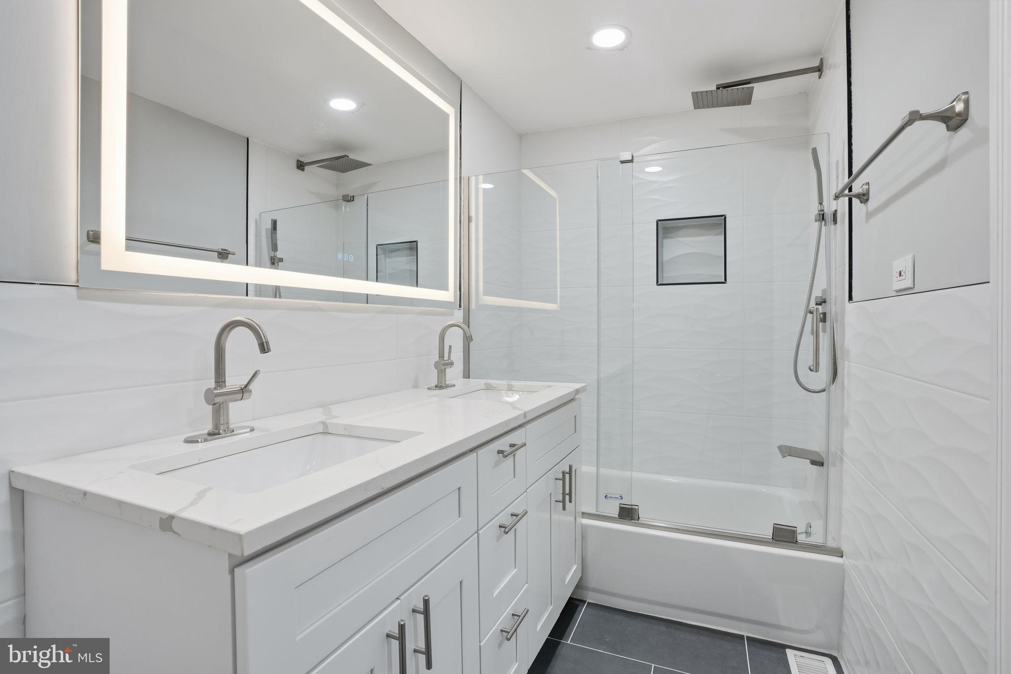 12827 Elnora Road Philadelphia, PA 19154 - Photo 17 of 36 Sleek modern bathroom with elegant finishes.