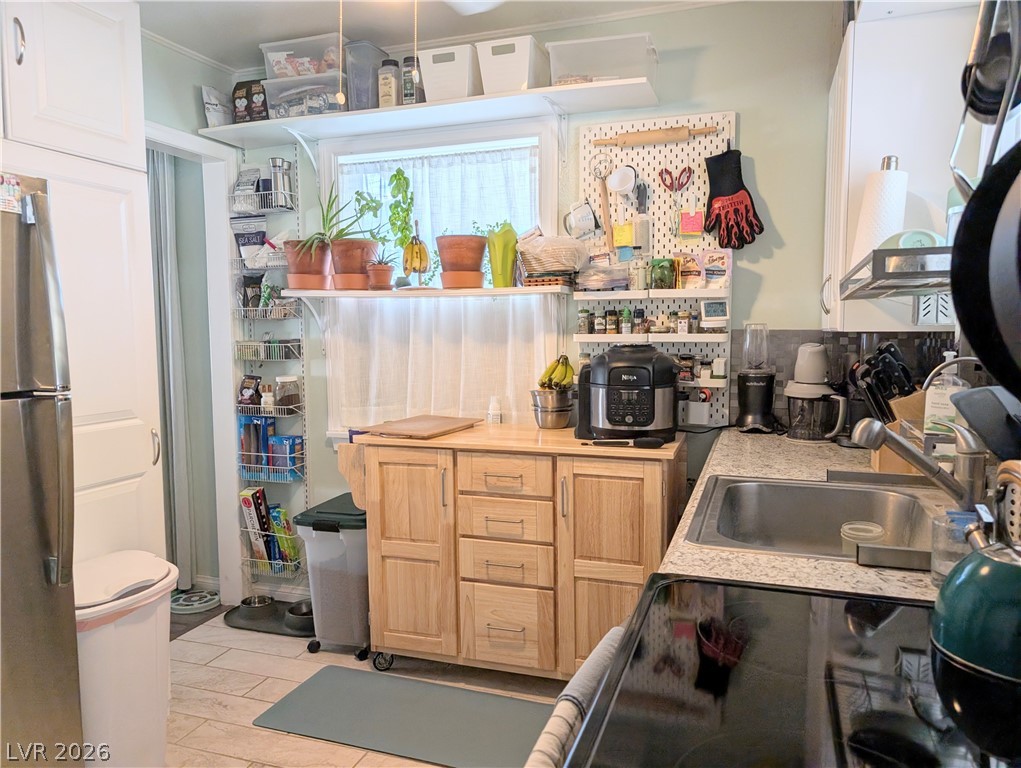 102 Rowan Drive Caliente, NV 89008 - Photo 9 of 28 Functional kitchen with ample storage and preparation space, perfect for culinary endeavors.