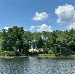 a view of a lake with a big yard
