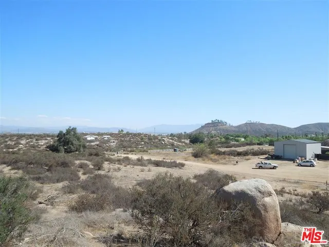 a view of a town with mountains in the background