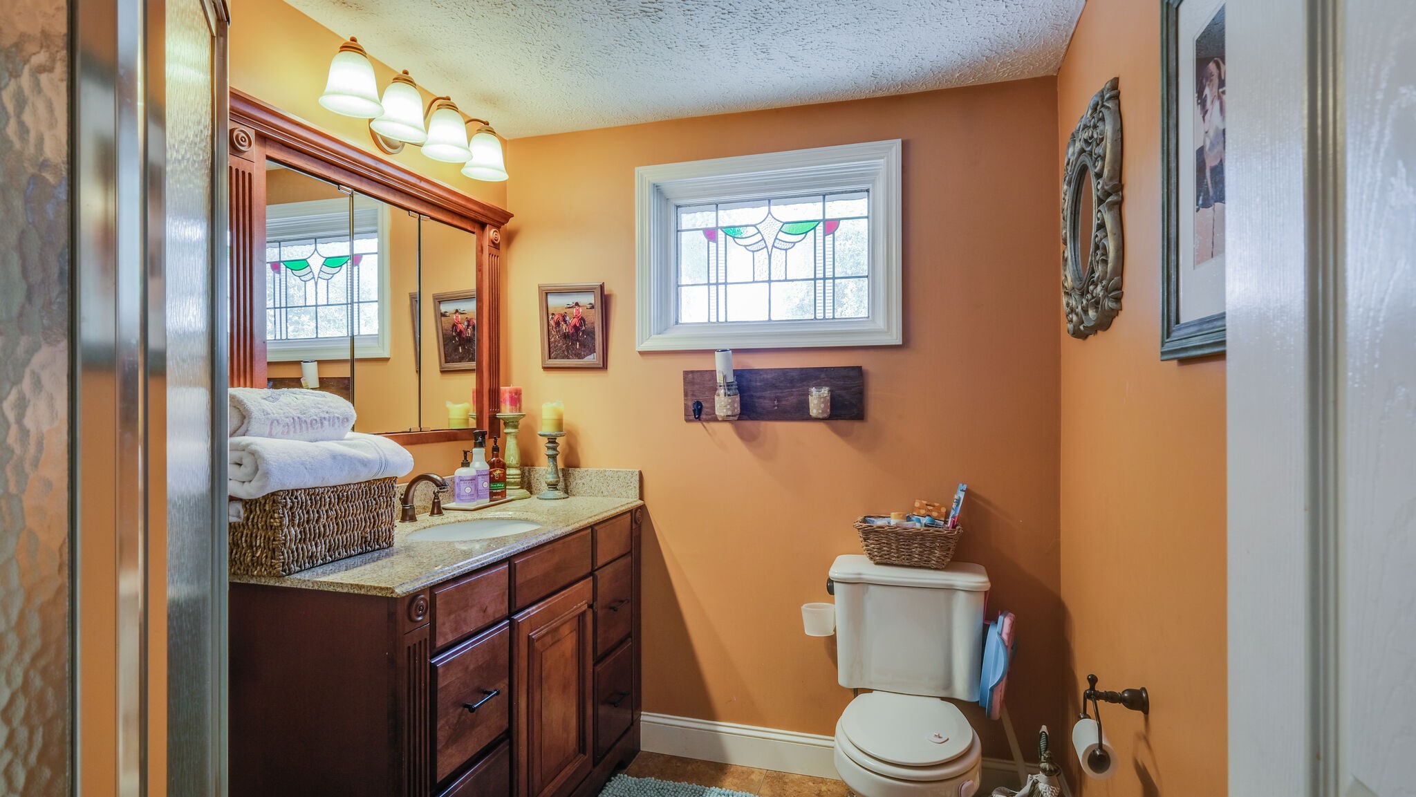 1434 Oak Hill Road Manchester, TN 37355 - Photo 14 of 40 a bathroom with a granite countertop toilet sink and mirror