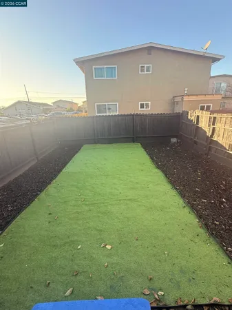 a view of hallway with wooden floor