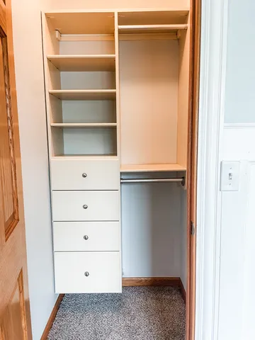 a view of an empty walk in closet