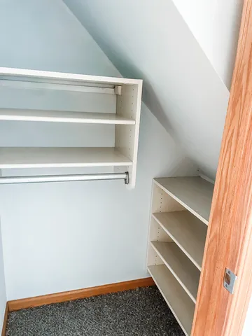 a view of an empty walk in closet