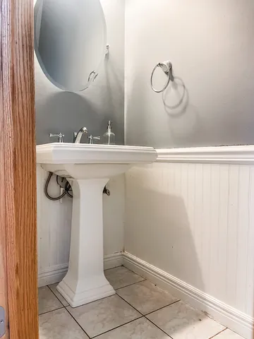 a bathroom with a sink and mirror