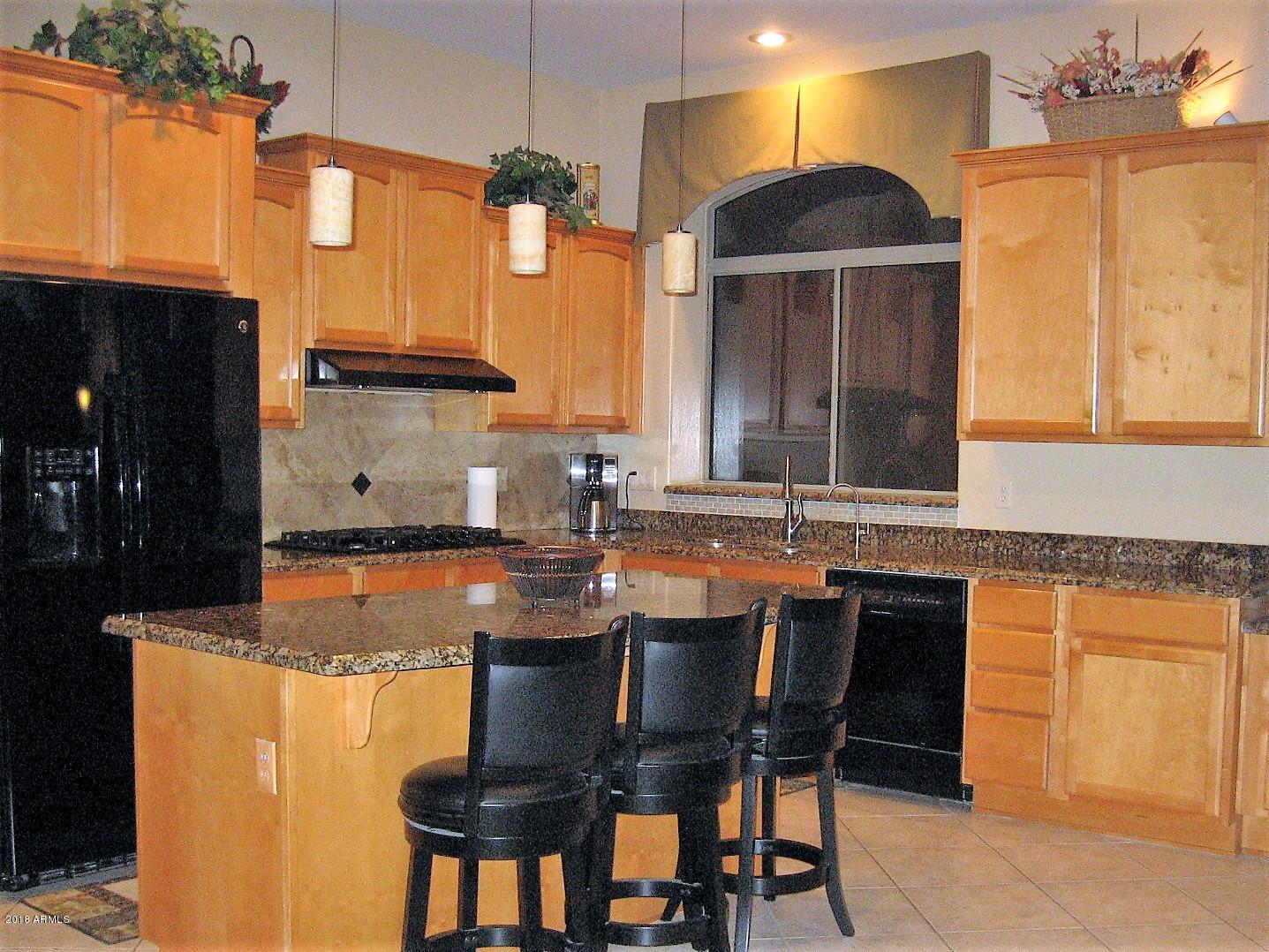 13382 West Coronado Road Goodyear, AZ 85395 - Photo 13 of 35 kitchen island