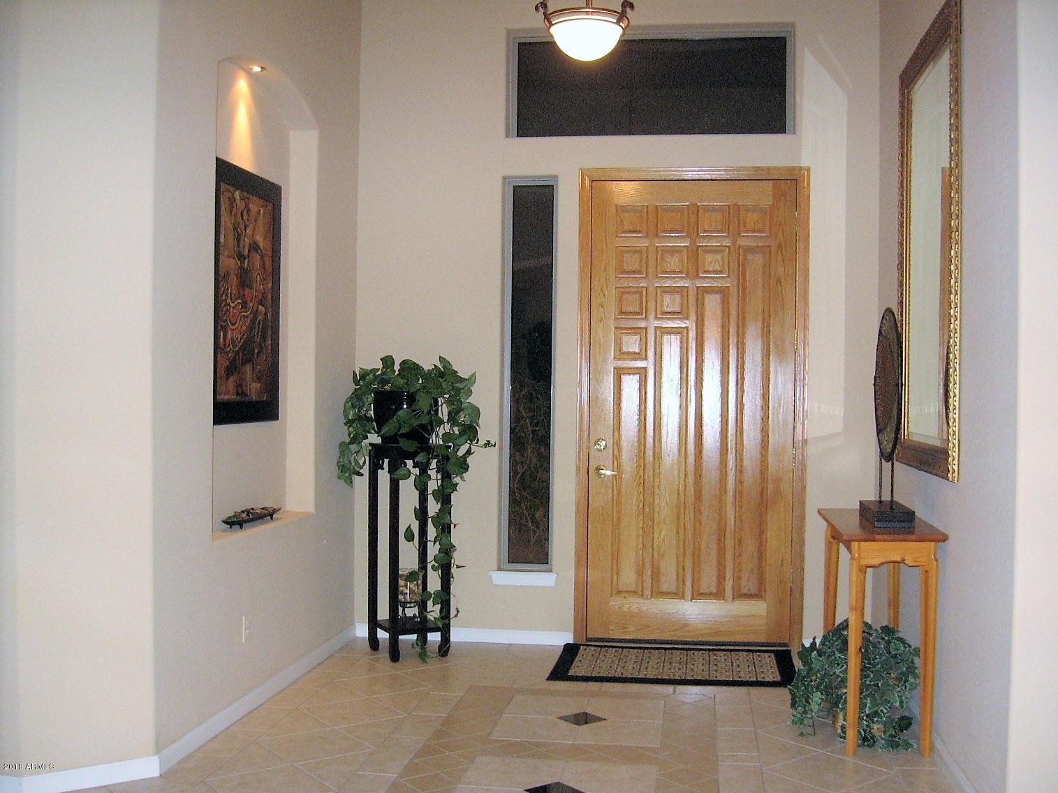 13382 West Coronado Road Goodyear, AZ 85395 - Photo 5 of 35 Tile inlay in foyer