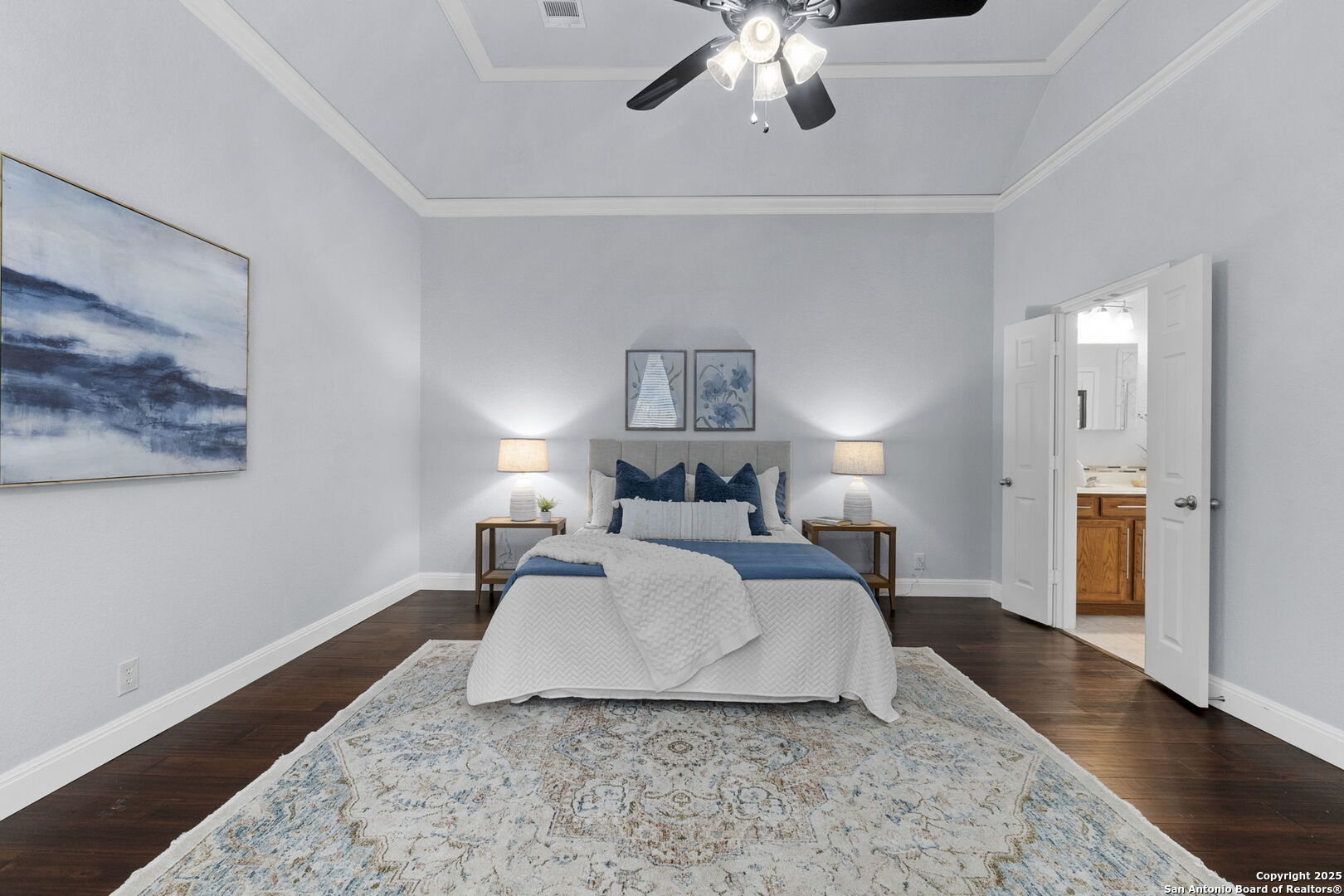 8607 Solano Drive Helotes, TX 78023 - Photo 13 of 30 a spacious bedroom with a bed and a chandelier