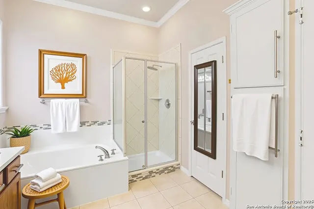 a bathroom with a tub and shower