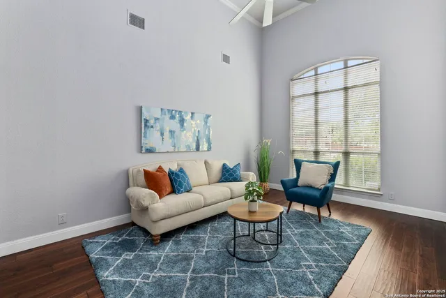 a living room with furniture and a window