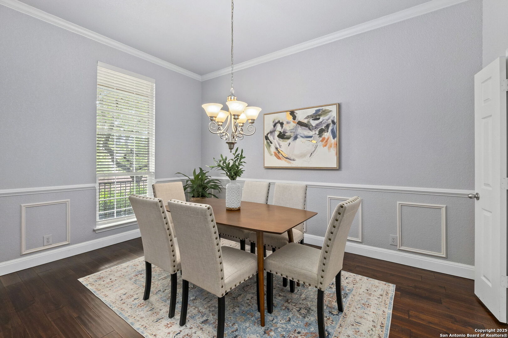 8607 Solano Drive Helotes, TX 78023 - Photo 8 of 30 a view of a dining room with furniture window and wooden floor