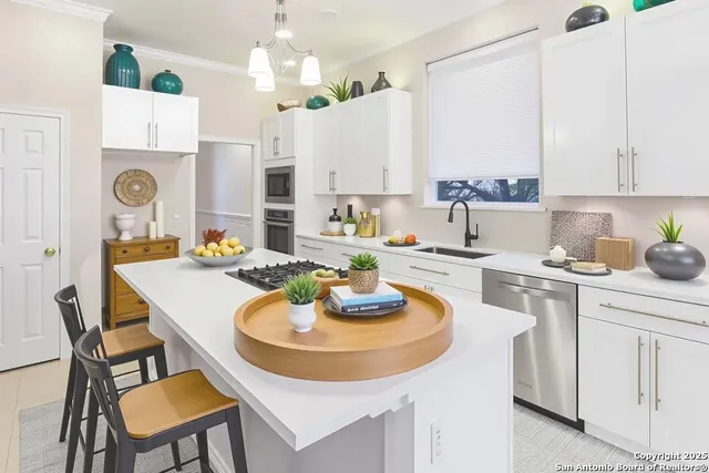 a kitchen with a dining table and chairs