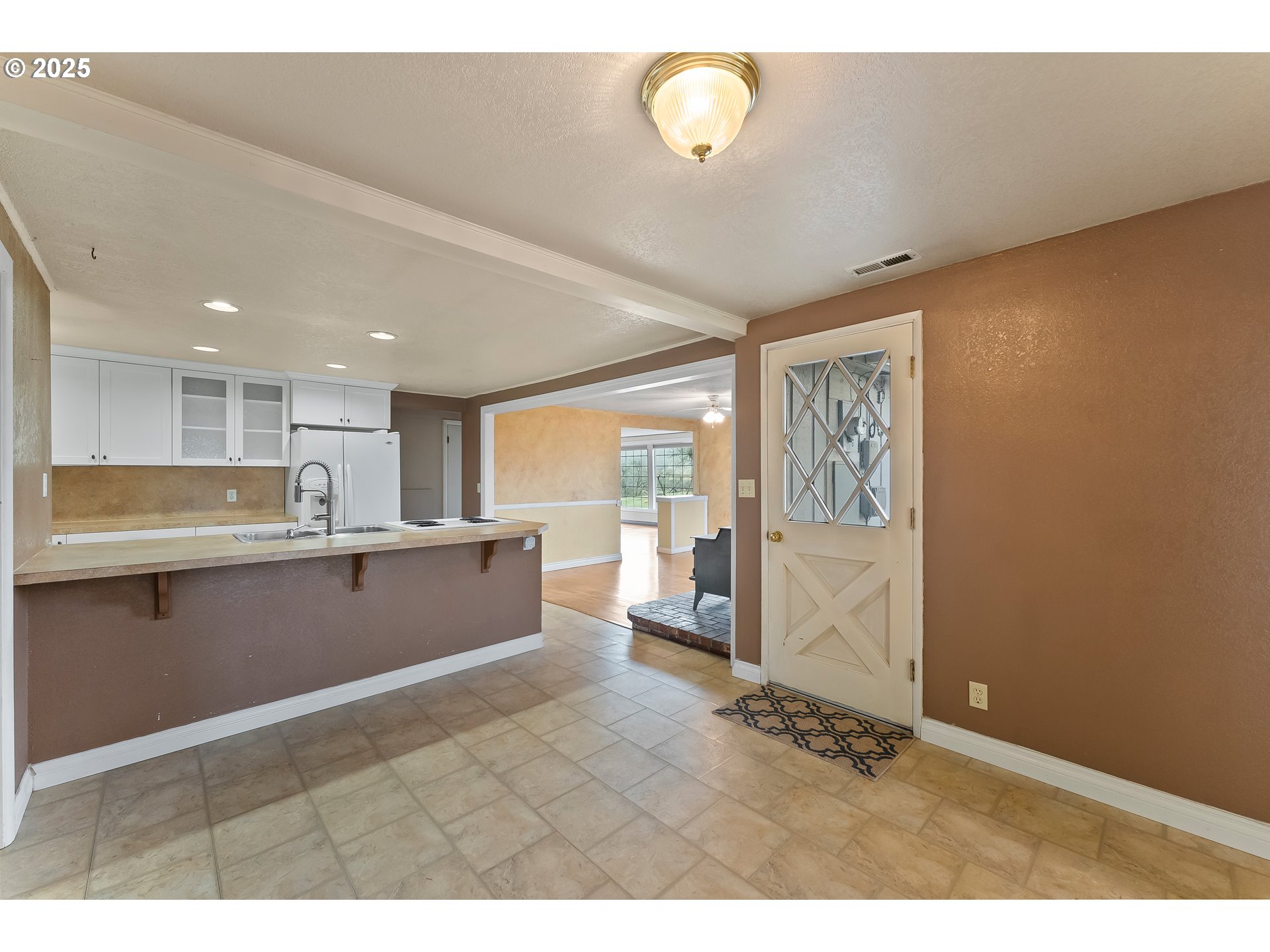 1183 Lookingglass Road Roseburg, OR 97471 - Photo 15 of 47 a large white kitchen with a large window