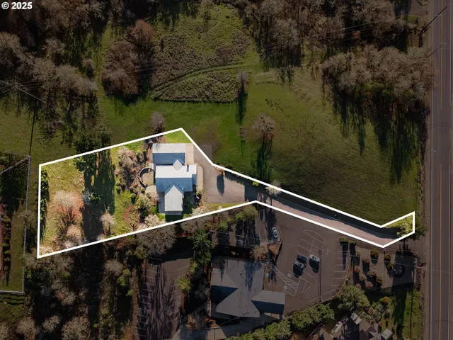 an aerial view of residential houses and outdoor space
