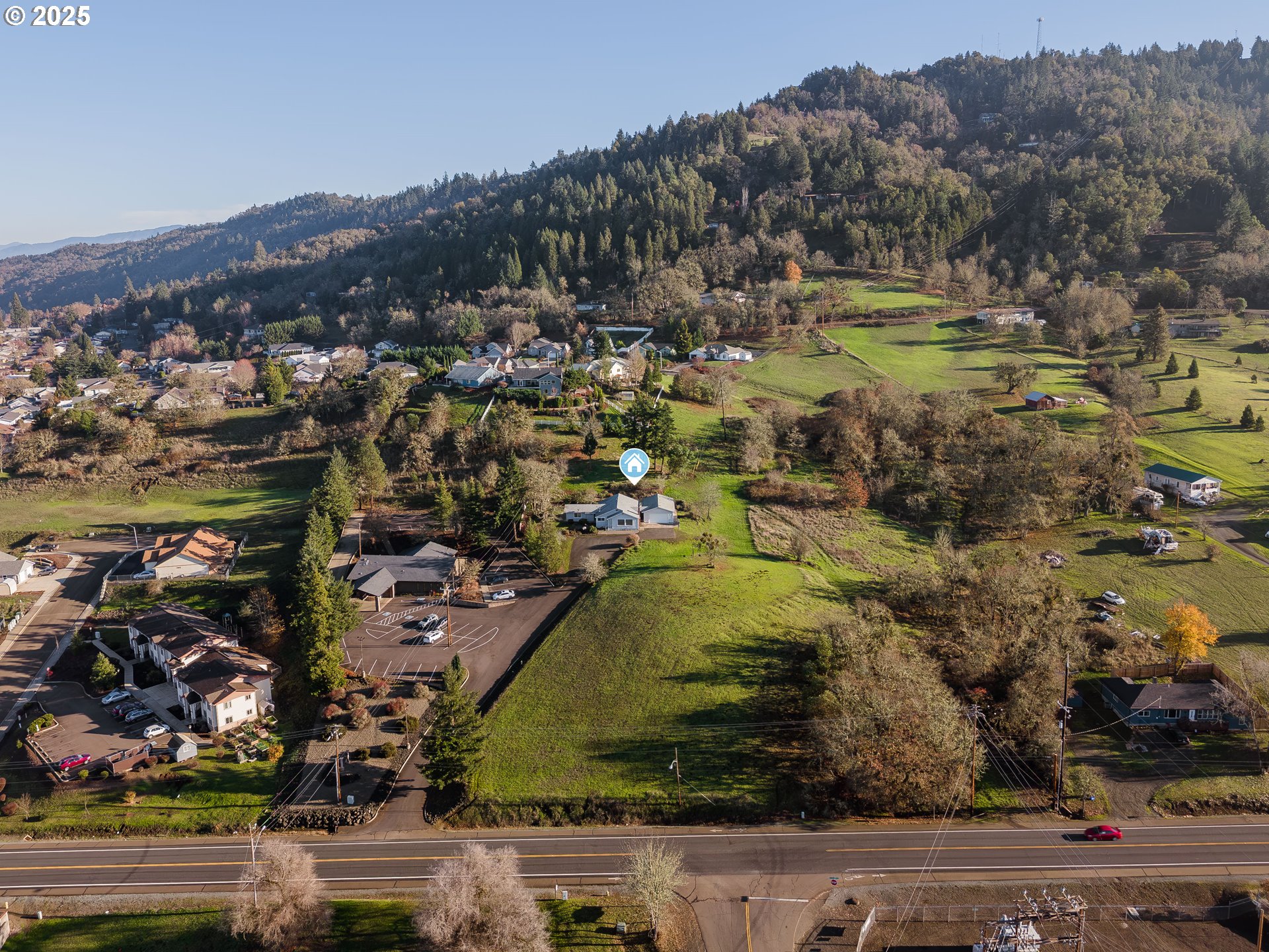 1183 Lookingglass Road Roseburg, OR 97471 - Photo 46 of 47 an aerial view of residential houses and outdoor space