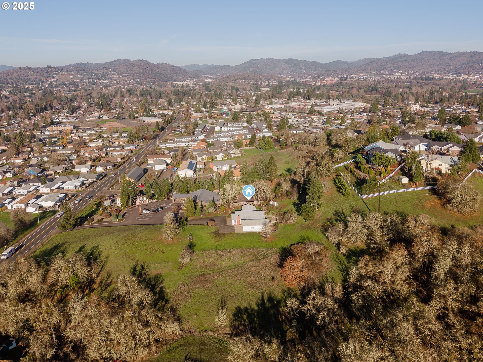 1183 Lookingglass Road Roseburg, OR 97471 - Photo 47 of 47 an aerial view of residential houses with outdoor space and trees
