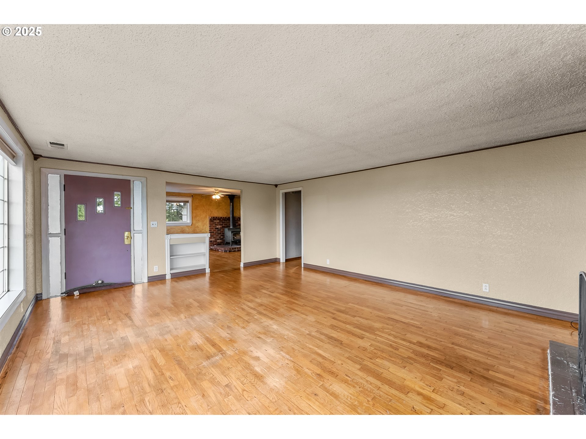1183 Lookingglass Road Roseburg, OR 97471 - Photo 6 of 47 a view of an empty room with window and a kitchen